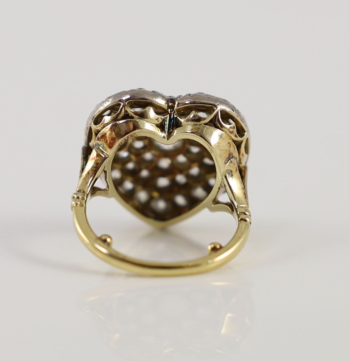 PROPERTY FROM THE COLLECTION OF HER ROYAL HIGHNESS THE PRINCESS MARGARET COUNTESS OF SNOWDON: An antique gold, silver and pave set diamond heart shaped dress ring